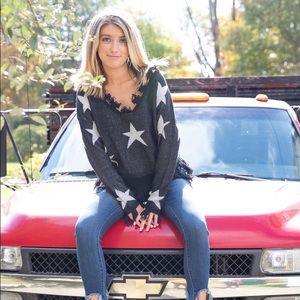 Distressed star sweater